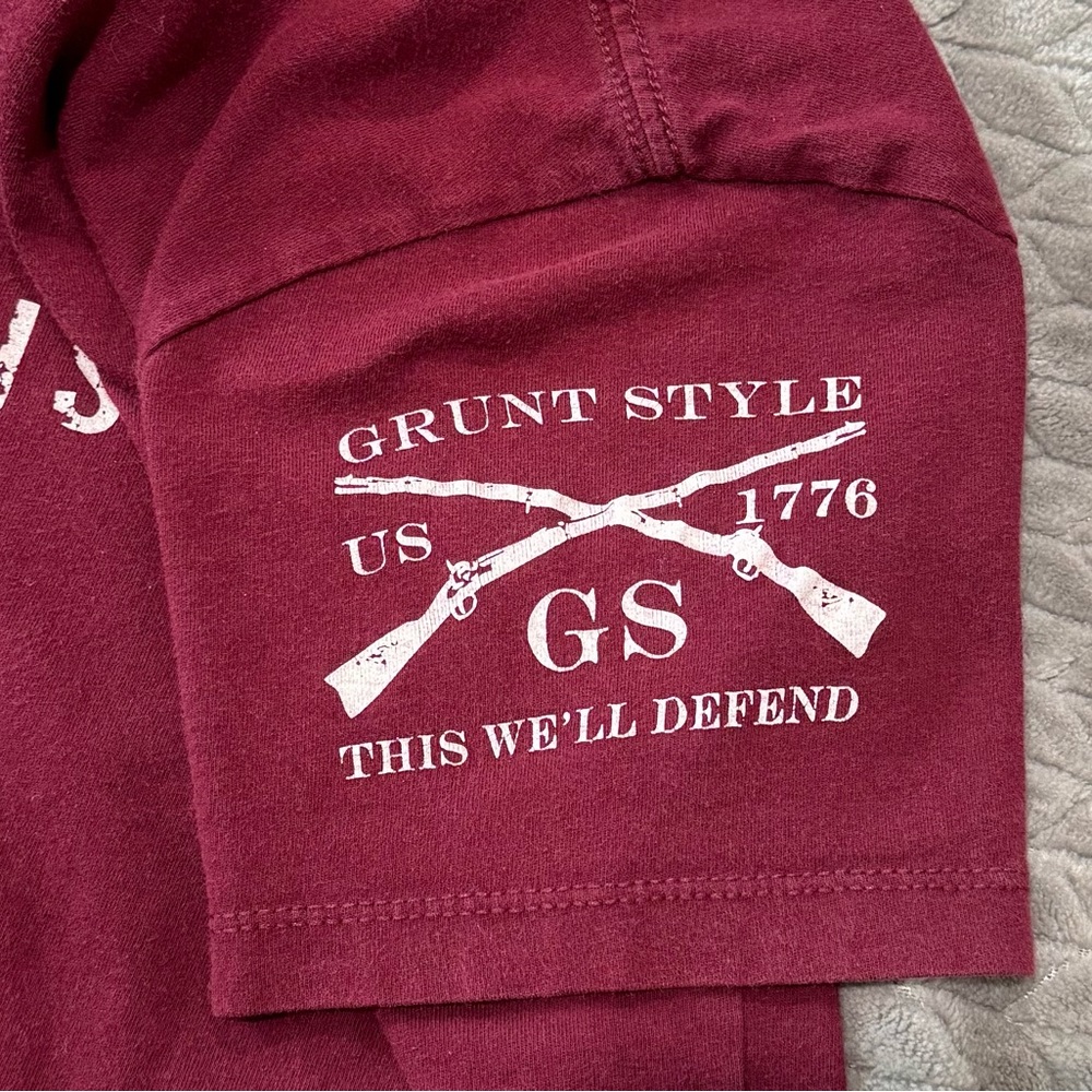 Small maroon grunt style shirt.